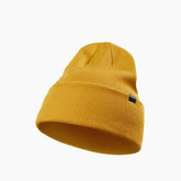 Berretto Root, un berretto in acrilico unisex giallo. Design minimalista. Di REV'IT!.